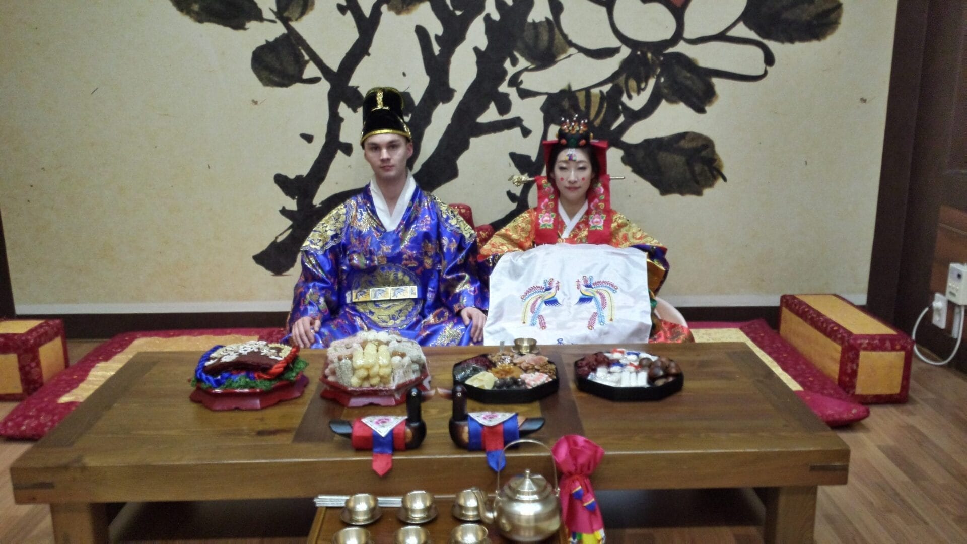 The Bride and Groom wear traditional ceremonial clothing for The Korean Pyebaek Tea Ceremony