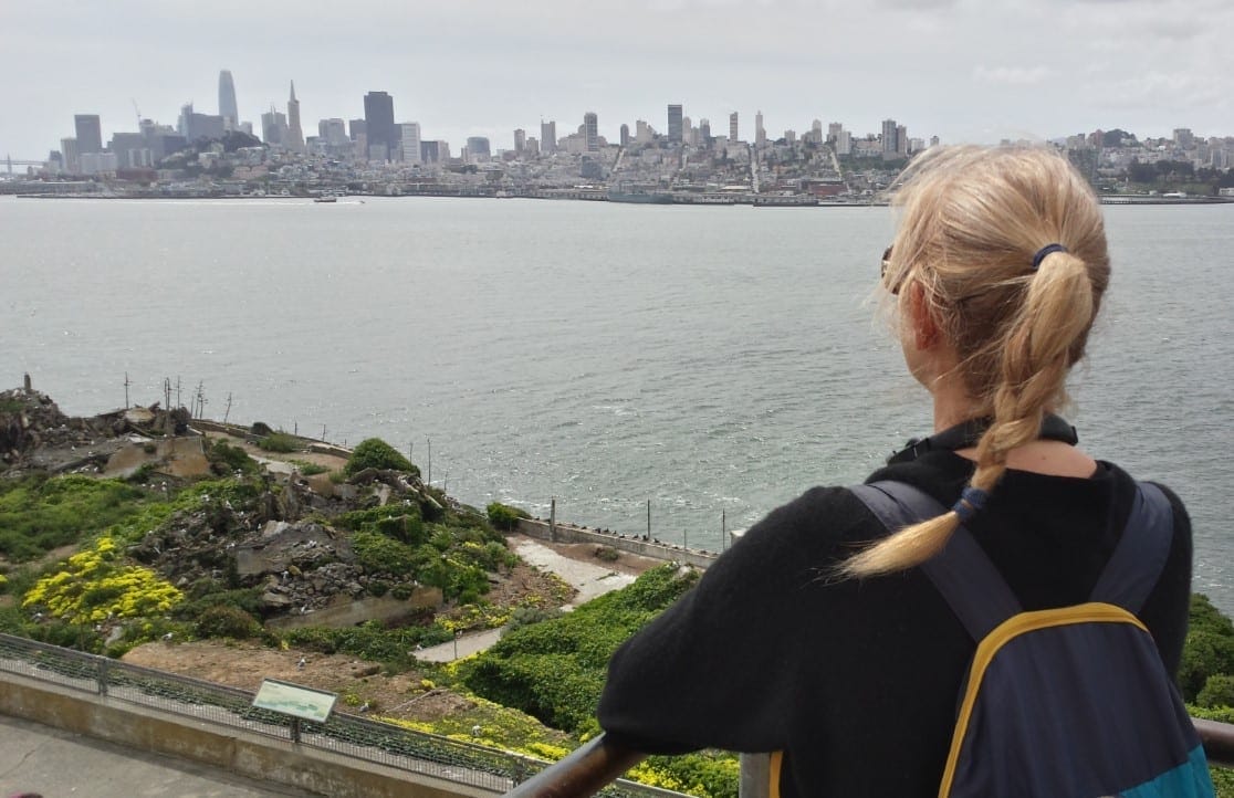 The Backpacking Housewife taking in the view of the city skyline of San Francisco and The Golden Gate Bridge