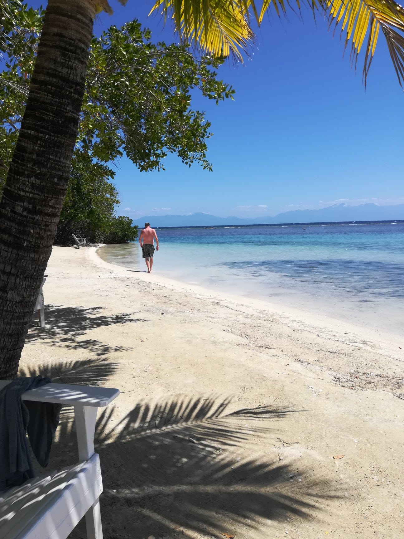 Beach walk... the Backpacking Husband on Bando Beach Utila