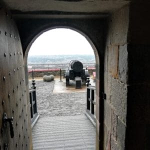 view of Mons Meg Gun through a doorway at Edinburgh Castle