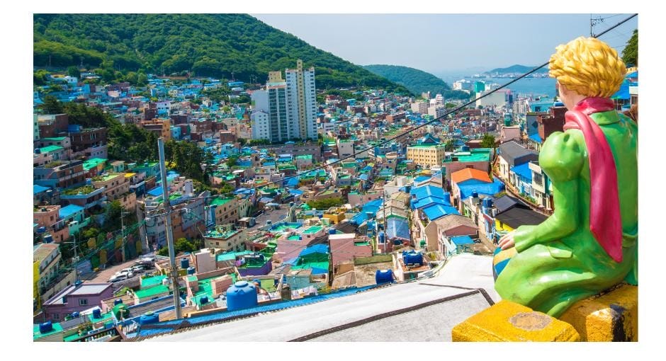 Gamcheon Village has the Little Prince and Fox statue sitting on a ledge looking over the city
