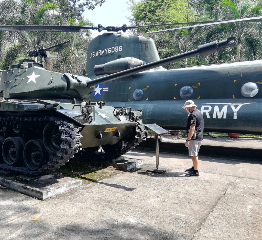 Tanks and Helicopter exhibits and the backpacking husband at the War Remnants Museum Saigon