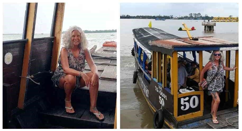 Janice Horton slow travel on a traditional wooden ferry boat on the Mekong River Vietnam