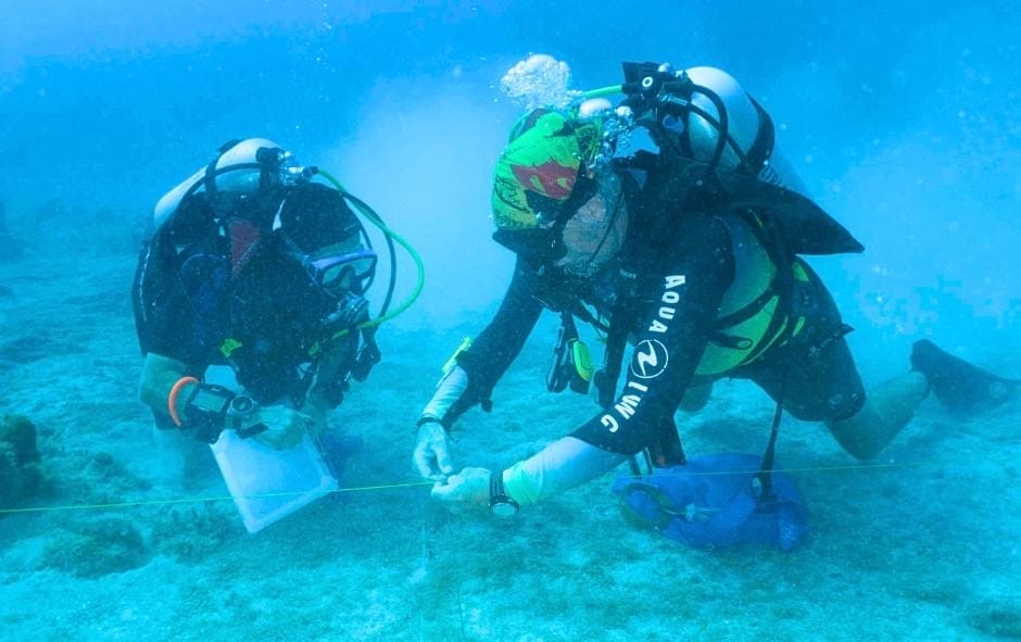 The backpacking husband on a dive project off Utila Honduras