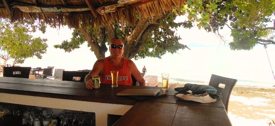 Backpacking husband at the Reef Resort bar on Koh Kradan Thailand