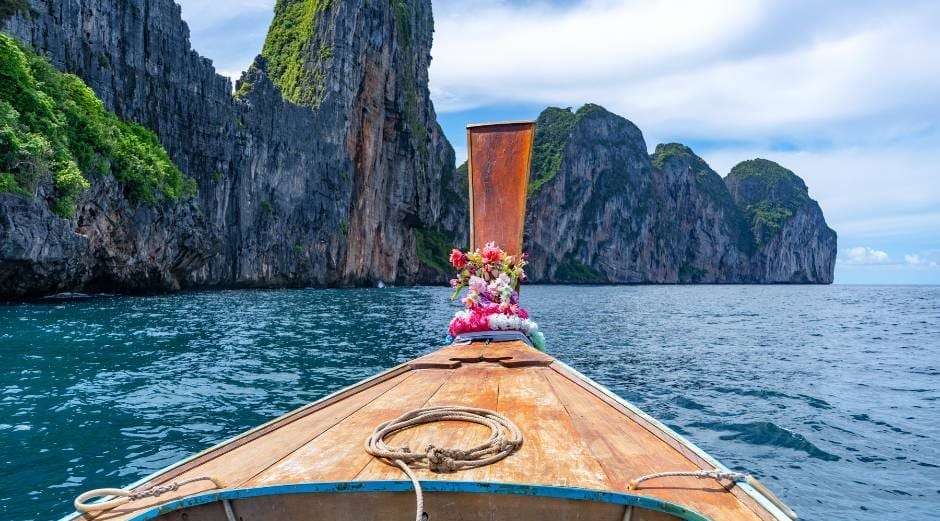 Traveling by longtail boat in Thailand