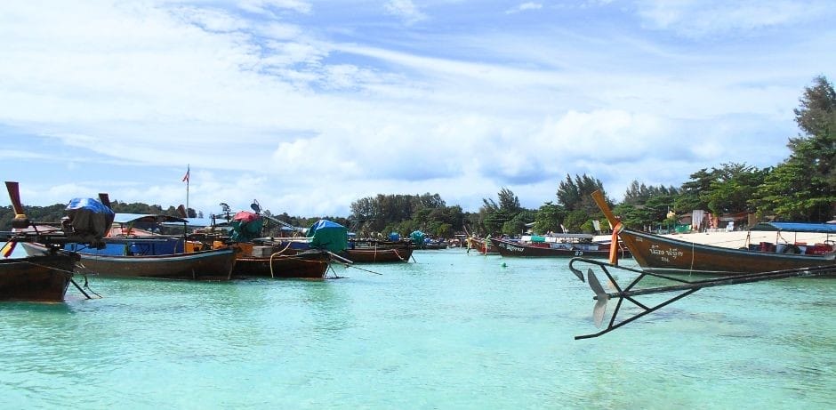 Longtail boats for as far as the eye could see on Koh Lipe - The Backpacking Housewife