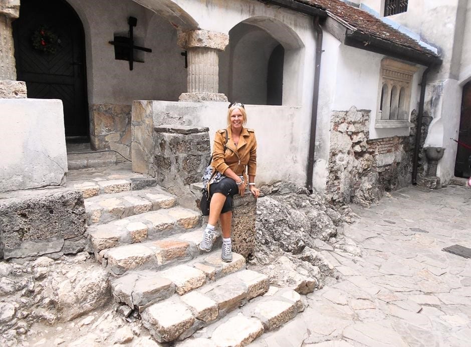 Janice Horton at Bran Castle Romania - Bran Castle - often called Dracula’s Castle is one of the most iconic landmarks in Romania.